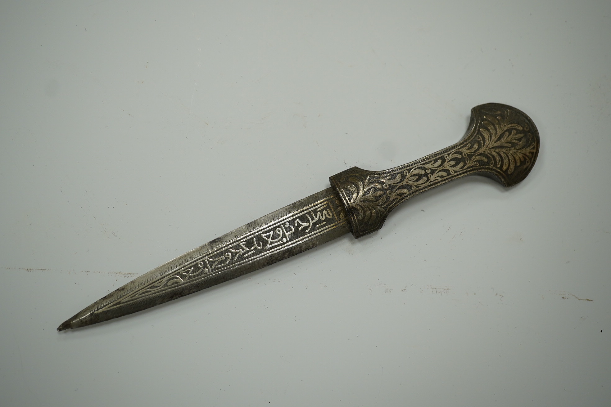 An Ottoman silver damascened dagger c.1900 in matching sheath, blade 9.7cm. Condition - fair